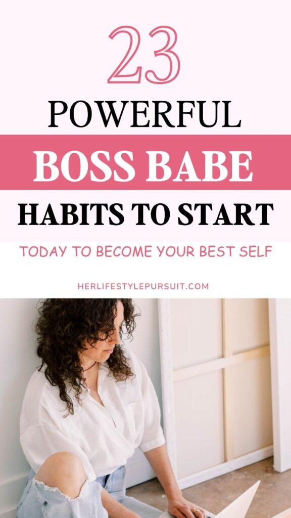 Pinterest pin with pink and white color scheme. Large text reads '23 POWERFUL BOSS BABE HABITS TO START' with subtitle 'TODAY TO BECOME YOUR BEST SELF'. The number '23' appears in outlined pink text at the top. Bottom features a lifestyle photo of someone in a white button-down shirt and distressed jeans working on a laptop. Website URL herlifestylepursuit.com appears in subtitle. Design uses elegant typography mixing black and white text on pink accents