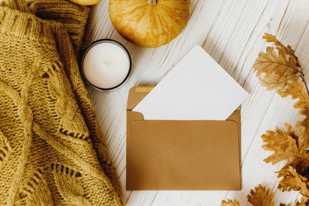 Invitation cards wrapped in fall aesthetics