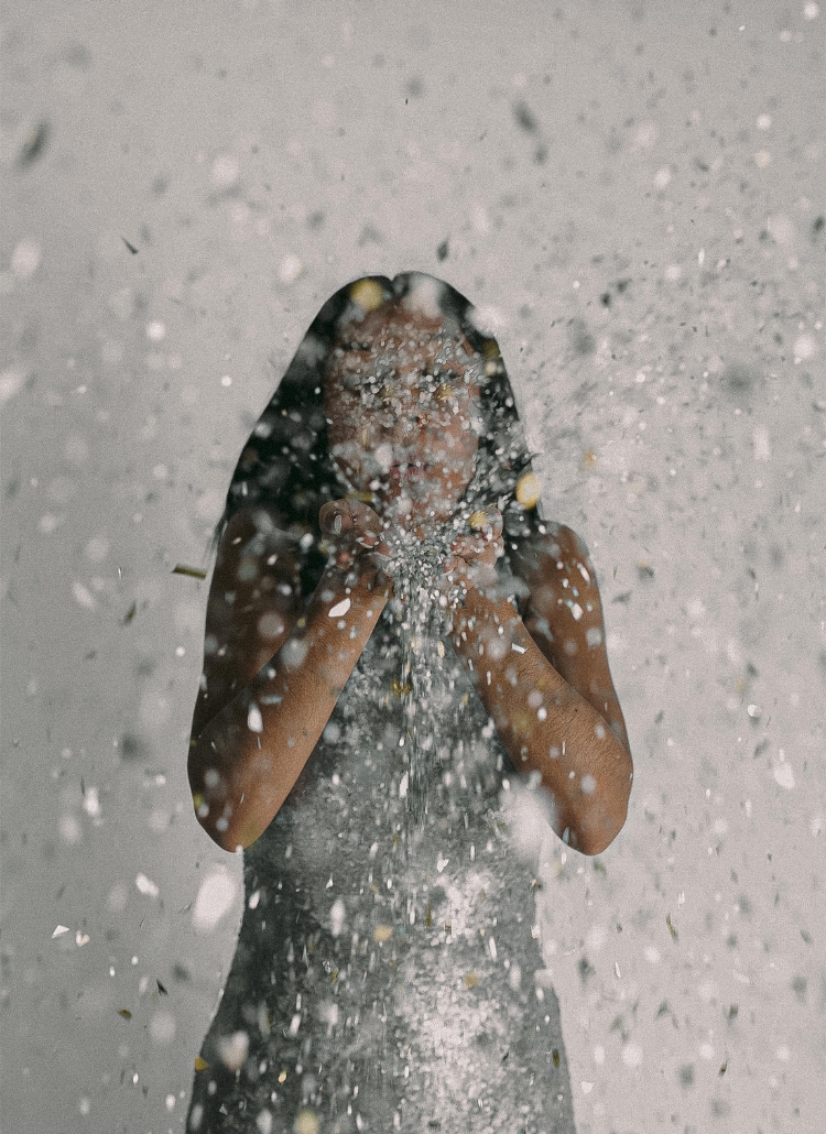 A featured image of a woman in a silver dress gleefully throws confetti, marking the start of the new year in a blog post about new year affirmations