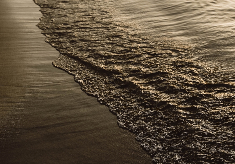 A wave approaching the shore, capturing the essence of high vibrations and nature's energy in motion. An image in a blog post about signs of high vibration person