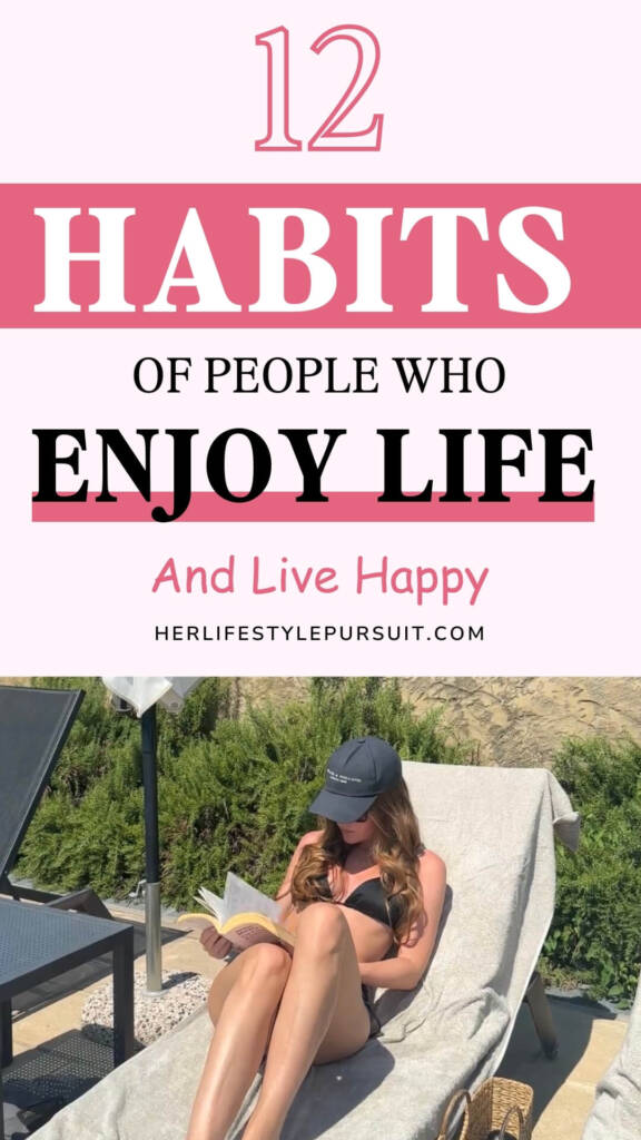 A woman in a black bikini lounging outdoors on a sunbed, reading a book with greenery in the background. Text overlay: "12 Habits of People Who Enjoy Life and Live Happy