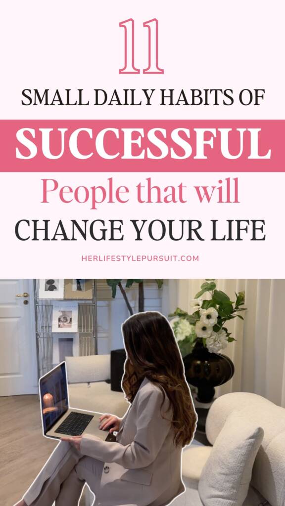 Pinterest-style pin with light pink background featuring title '11 Small Daily Habits of Successful People that will Change Your Life' above a lifestyle photo of a woman in beige suit working on laptop in an elegant home office setting