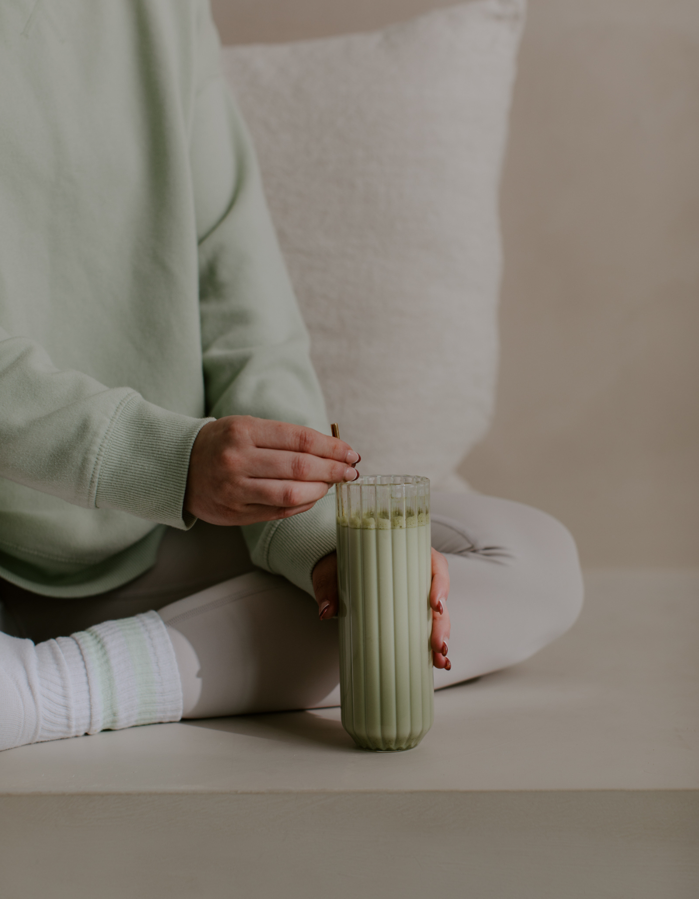 Flat lay of cozy feminine self-care essentials including a journal, candle, and skincare items on a white background — perfect for a self care routine blog post targeting women focused on wellness and mindfulness.