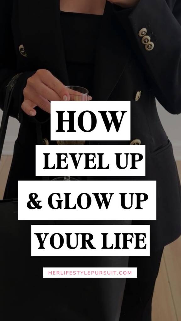 Elegant woman in black blazer holding wine glass representing sophisticated lifestyle and personal transformation — how to level up and glow up your life